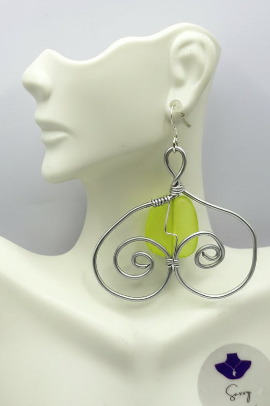 silver spiral earring wih yelloe bead